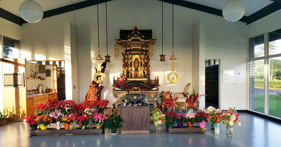 Columbarium altar with flowers and sunlight
